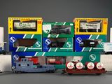 a lot of toy trains that are lined up together