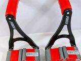 pair of red and black tennis racquets on a white surface