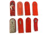 six pairs of red and silver metal items on a white surface