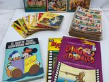 several children ' s books are sitting on a table with a white background