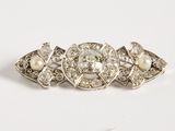 an antique diamond and pearl broochle ring