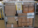 a metal cart with many boxes on it in a warehouse