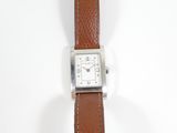an image of a close up of a wrist watch on a white surface
