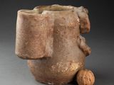 an image of a vase with a face on it