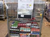 a metal cart with a lot of books on it