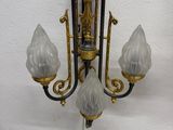 a chandelier hanging on the wall in the room