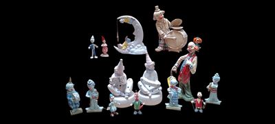 many figurines of different shapes and sizes on a black background