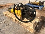 a machine that is sitting on a pallet in the dirt