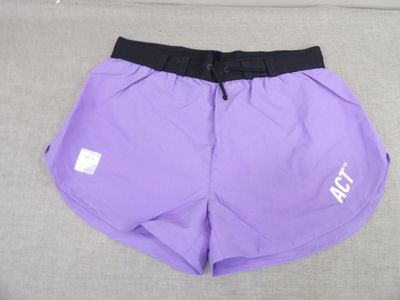 a close up of a pair of purple shorts on a couch