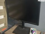 an image of a desk with a computer monitor and a cell phone