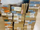 a pile of boxes on top of a pallet in a store