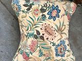 a close up of a cushion on the floor near a door