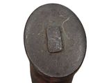 a metal object that is sitting on top of a white surface
