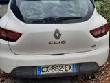 a white car parked on the side of the road