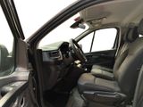 the interior of a car with the door open and the driver ' s seat down