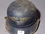 a helmet that has a gold eagle on it