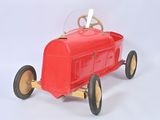 a small red toy car with a steering on a white surface