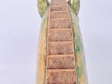 a ceramic sculpture of a bear ' s head with stairs
