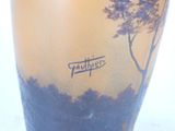 a vase with a picture of a tree on it