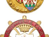 three medals of different colors and designs on a white background