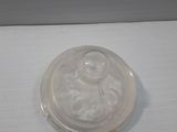 a plastic container with a lid on a white surface