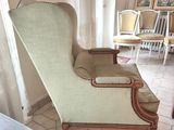 a chair that is sitting in the corner of a room