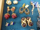 a lot of jewelry that is sitting on a table