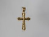 a gold cross pendant on a white background