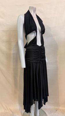 a mannequin with a black dress on a mannequin base
