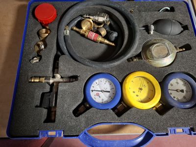 a blue case with a bunch of tools in it