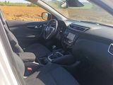 the interior of a white car with black seats and a steering wheel