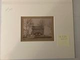 la photo d'une photo représentant une maison, dans un cadre