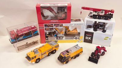 a lot of toy vehicles that are sitting on a table