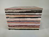 a stack of cds stacked on top of each other