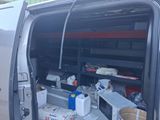 a van with a lot of items in the back of it