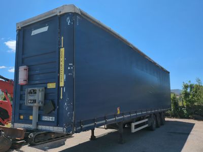 a semi truck that is parked in a lot