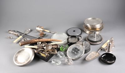 a pile of silver objects on a gray surface
