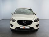 a white mazda cx - 5 parked in a white room