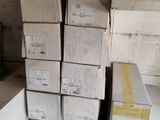 many boxes stacked on top of each other in a room