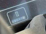 a close up of a car ' s engine with a yellow sticker on it