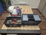 a table with tools and a hard hat on top of it