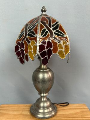 an image of a lamp with a stained glass shade on it
