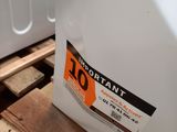 a white container sitting on top of a wooden pallet