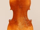 an old violin with a wooden back and a long neck
