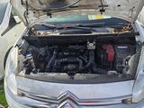 a car that has its hood open with the engine in it