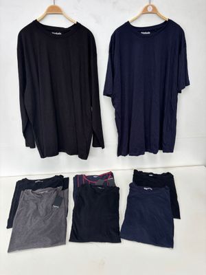 men ' s long sleeved t - shirts and pants on a hanger