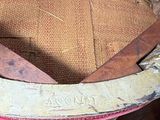 an old wooden bucket with a wooden handle on a table
