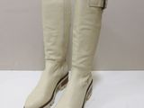 white leather boots with zippers and zippers on the sole