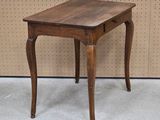 a small wooden table with a drawer underneath it
