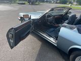 a car with its door open in a parking lot